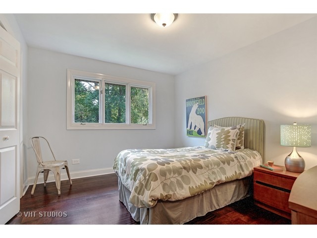 3720 Wilke Road Rolling Meadows, IL 60008 - Photo 14 of 25 a bedroom with a bed chair and window