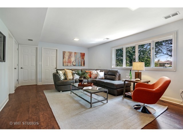 3720 Wilke Road Rolling Meadows, IL 60008 - Photo 18 of 25 a living room with furniture and a large window