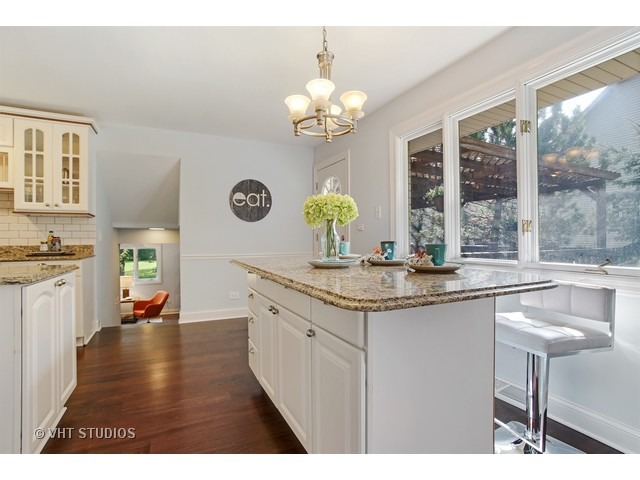 3720 Wilke Road Rolling Meadows, IL 60008 - Photo 4 of 25 a kitchen with center island with large windows