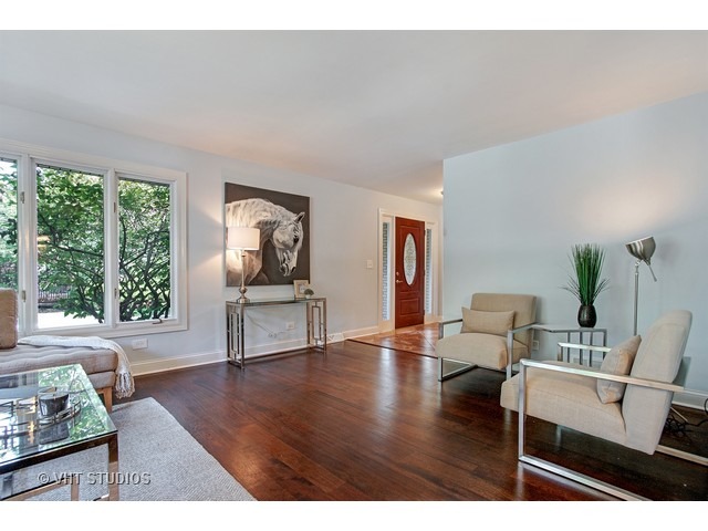 3720 Wilke Road Rolling Meadows, IL 60008 - Photo 7 of 25 a living room with furniture and wooden floor