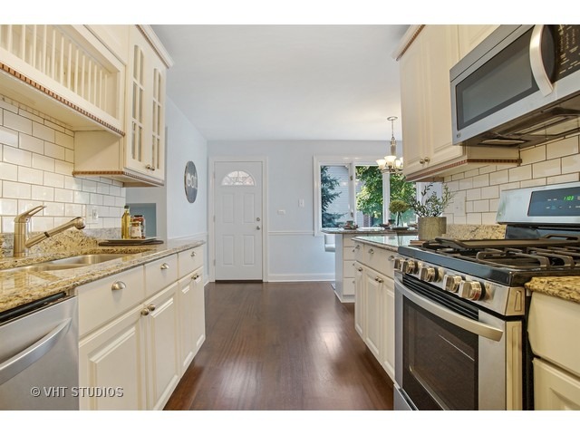 3720 Wilke Road Rolling Meadows, IL 60008 - Photo 9 of 25 a kitchen with stainless steel appliances granite countertop a stove and a sink