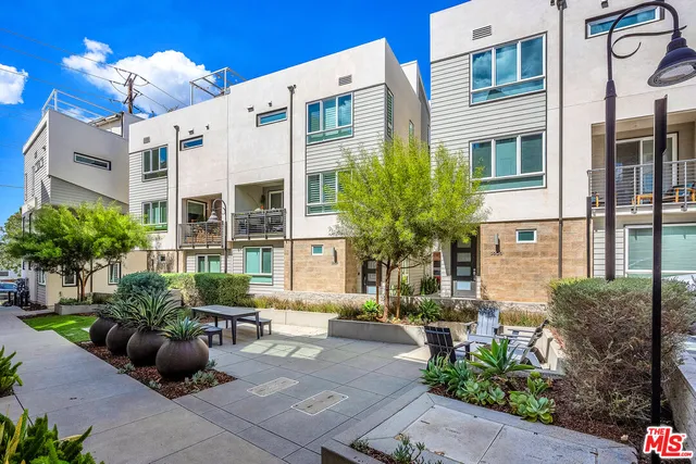 a view of a chairs and table in the patio