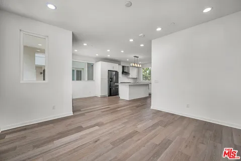 a view of kitchen view wooden floor and window