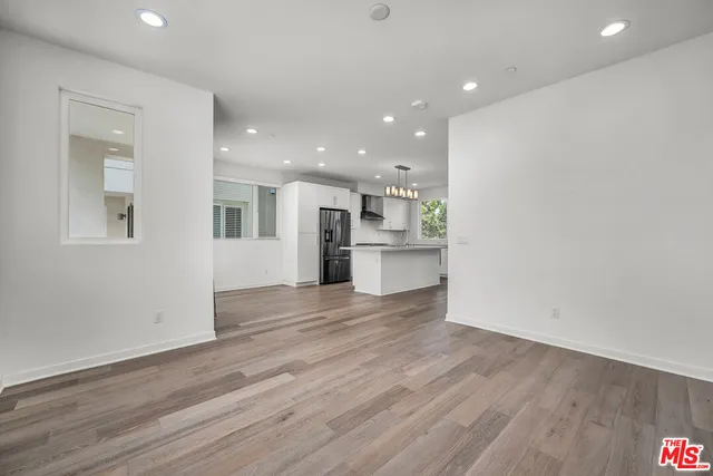 a view of kitchen view wooden floor and window