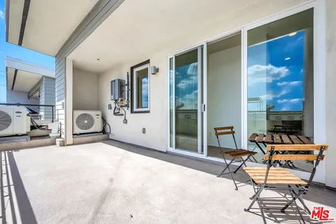 a view of a livingroom with furniture and windows