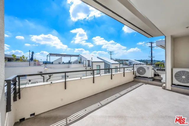a view of a living room with kitchen