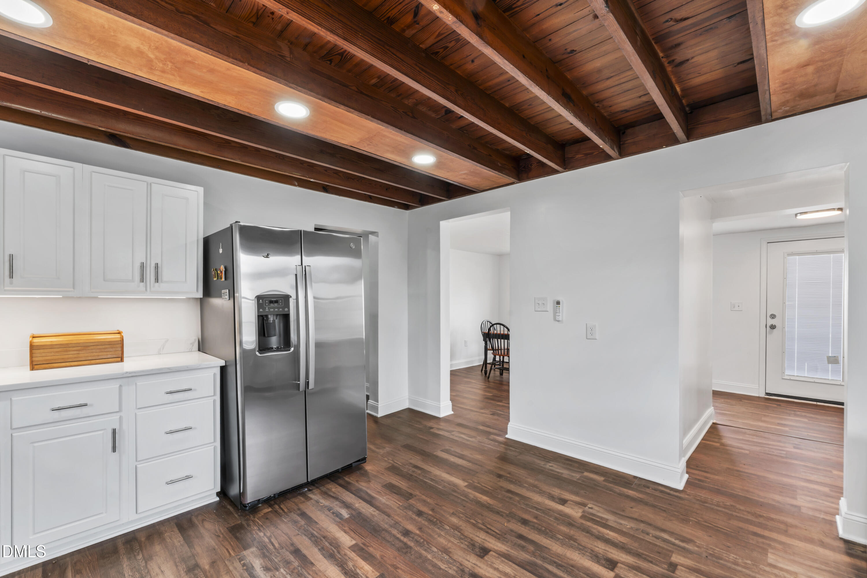 141 South Broad Street East Angier, NC 27501 - Photo 15 of 43 a view of a kitchen with wooden floors and cabinet