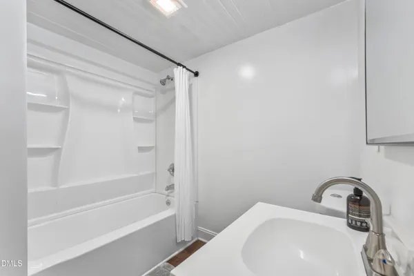 a bathroom with a sink a toilet and a bathtub