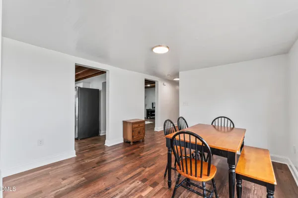 a view of a dining room with furniture and window