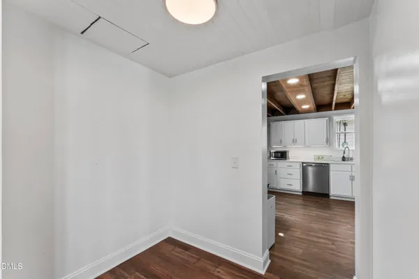a view of a kitchen with a sink and dishwasher