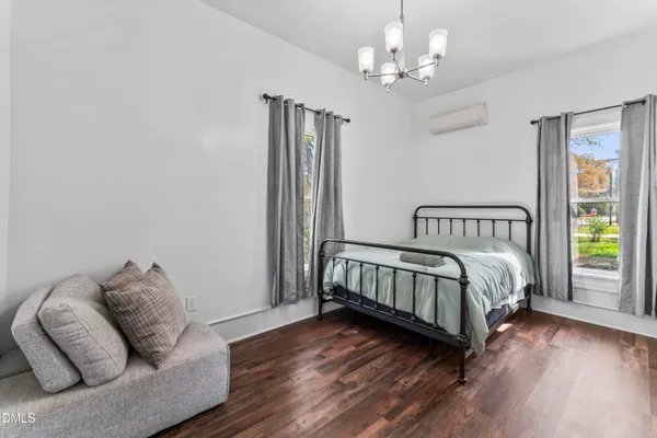 a bedroom with bed and a couch