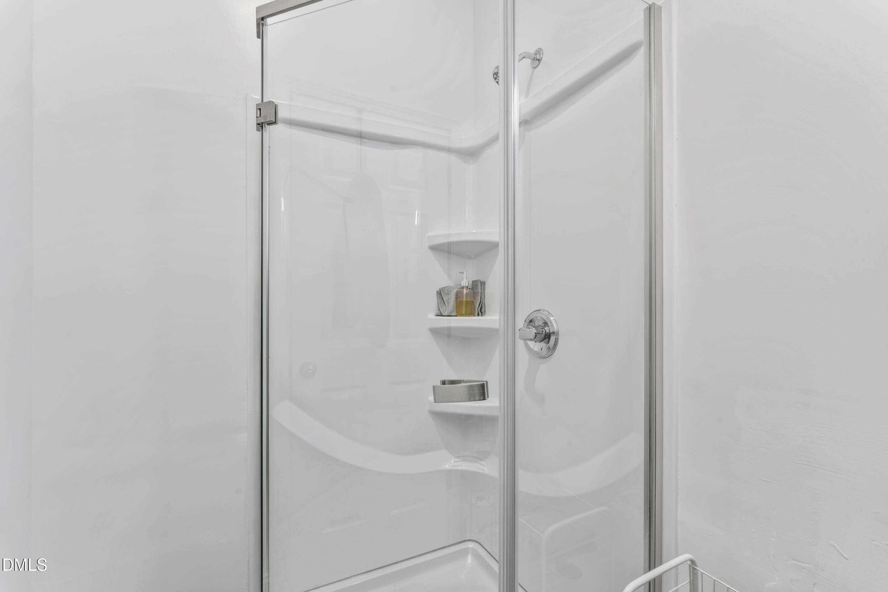 141 South Broad Street East Angier, NC 27501 - Photo 31 of 43 a bathroom with a glass shower door