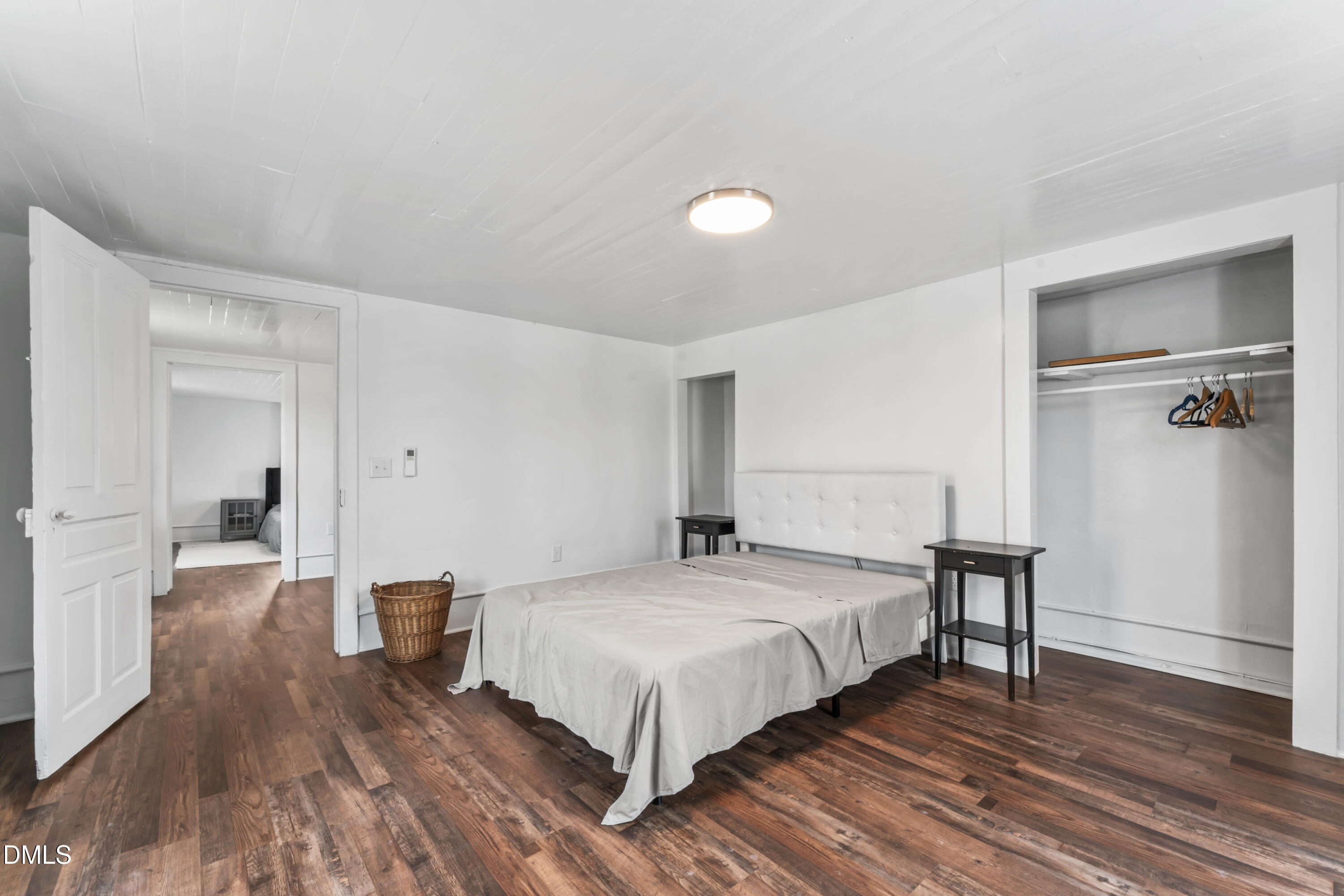 141 South Broad Street East Angier, NC 27501 - Photo 34 of 43 a bedroom with a bed and wooden floor
