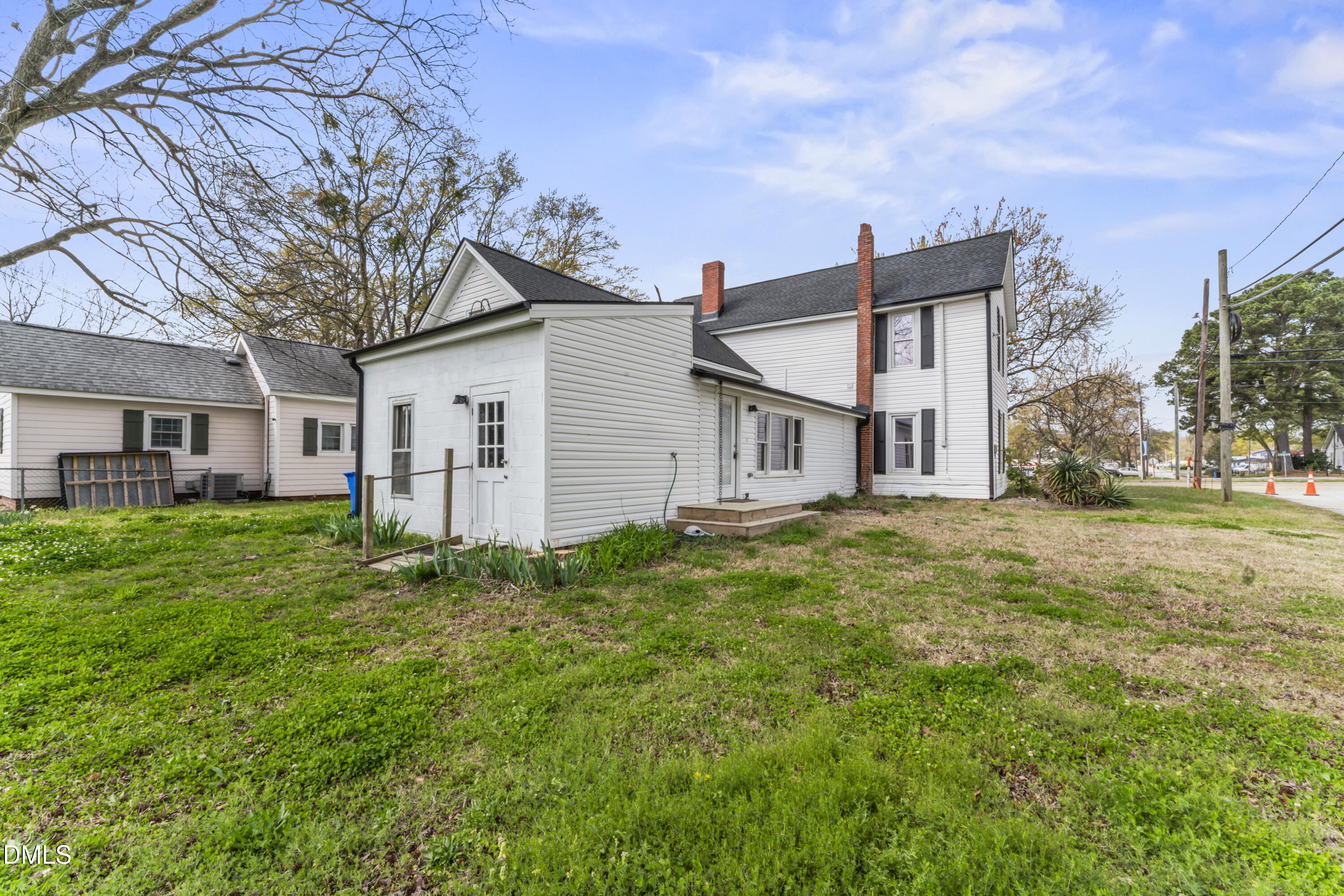 141 South Broad Street East Angier, NC 27501 - Photo 7 of 43 a view of a house with a yard