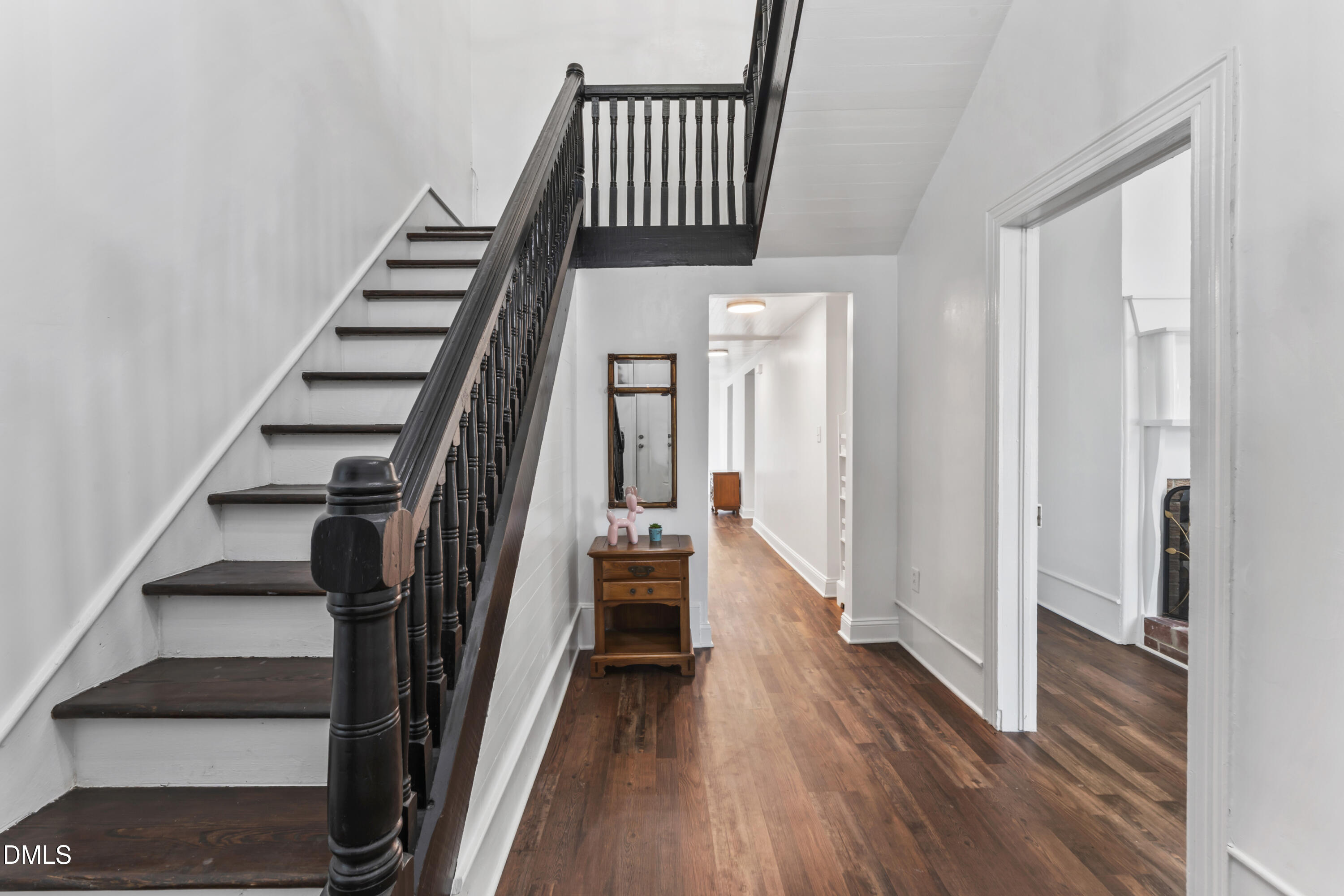 141 South Broad Street East Angier, NC 27501 - Photo 9 of 43 a view of a hallway with wooden floor and entryway