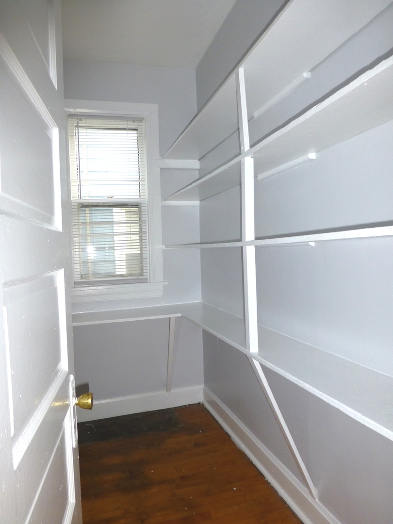 Undisclosed Address Chicago, IL 60647 - Photo 13 of 14 a view of an empty walk in closet