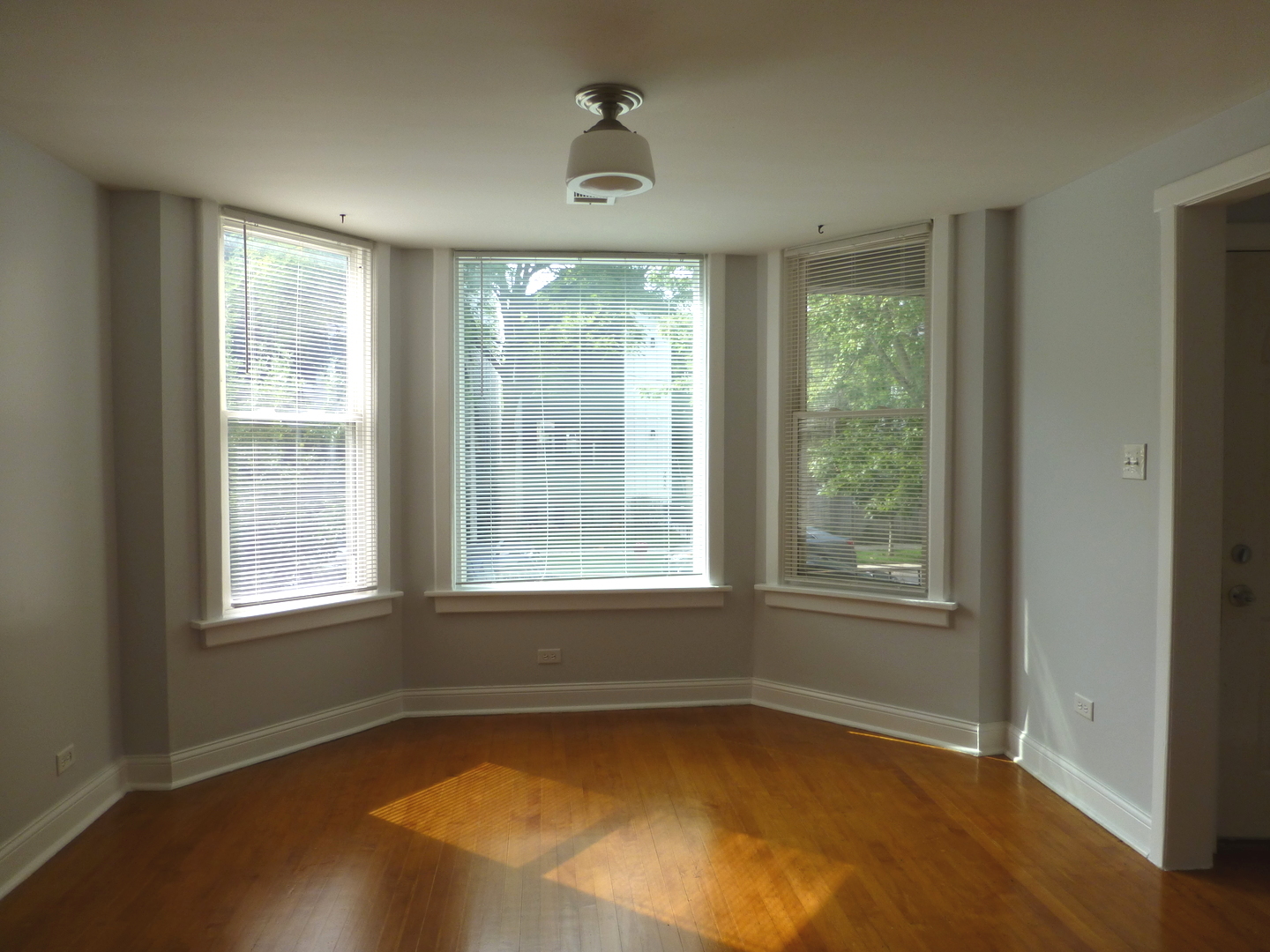 Undisclosed Address Chicago, IL 60647 - Photo 2 of 14 an empty room with a window