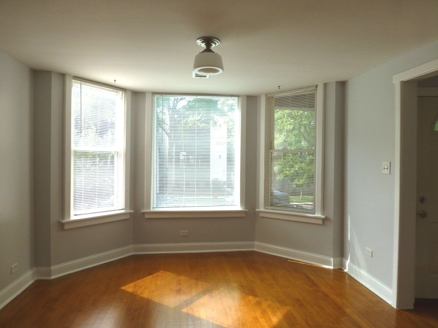 Undisclosed Address Chicago, IL 60647 - Photo 3 of 14 a view of a livingroom with a window