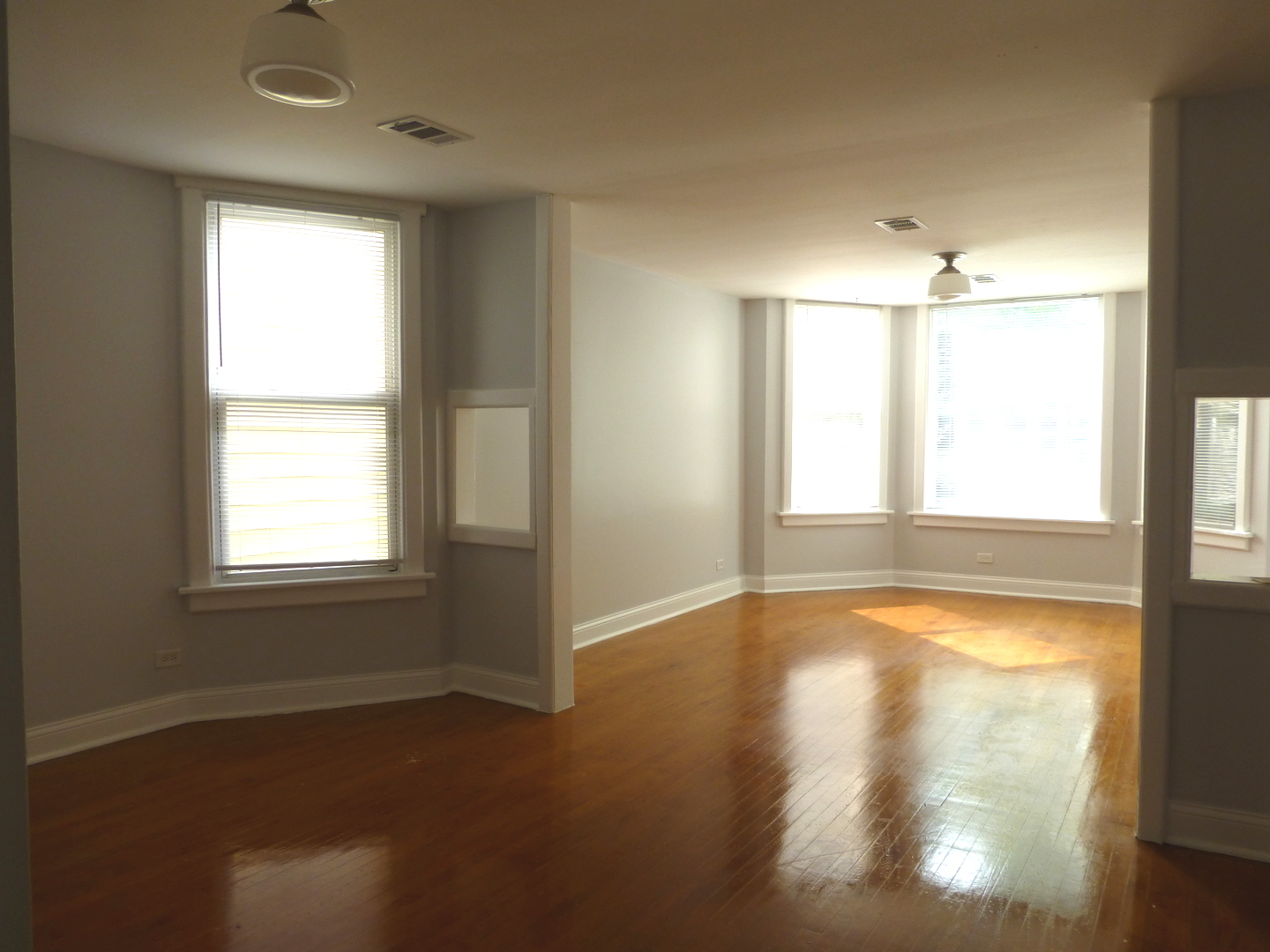 Undisclosed Address Chicago, IL 60647 - Photo 5 of 14 a view of an empty room with a window