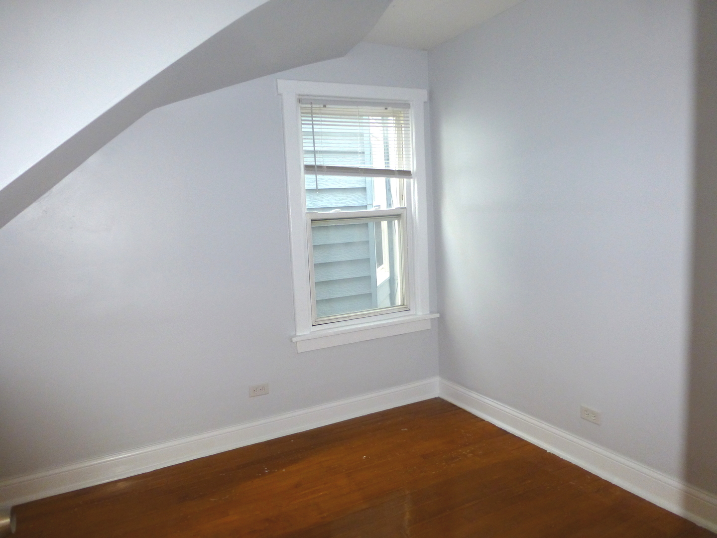 Undisclosed Address Chicago, IL 60647 - Photo 7 of 14 an empty room with a window