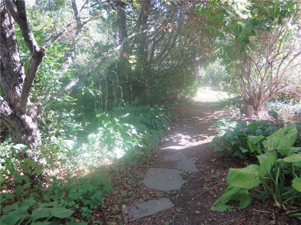 17 Storer Road Bremen, ME 04551 - Photo 7 of 18 A stepping stone pathway amount the...