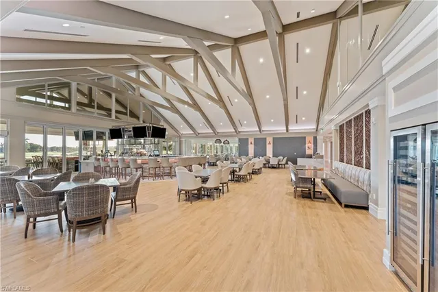 a living room with lots of furniture and white walls