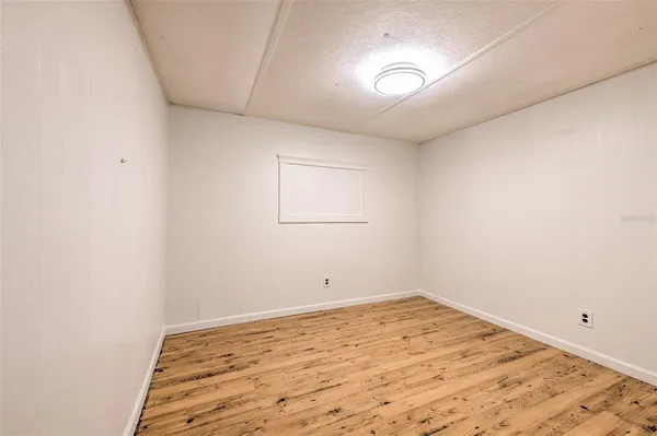an empty room with a empty space and a window