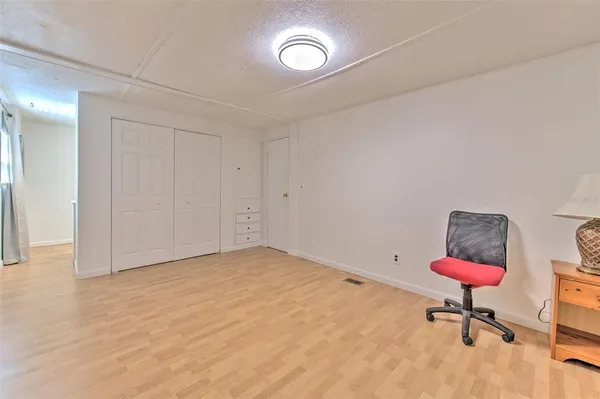 a view of room with a table and a chair