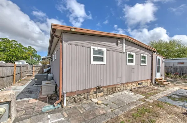 a backyard of a house with seating space