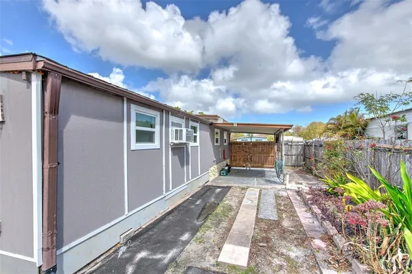 a view of a house with a backyard