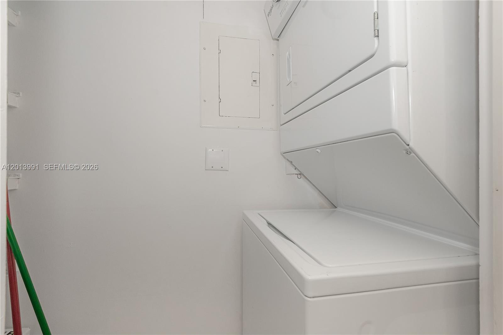 90 Alton Road, Unit 1007 Miami Beach, FL 33139 - Photo 17 of 25 a utility room with dryer and washer