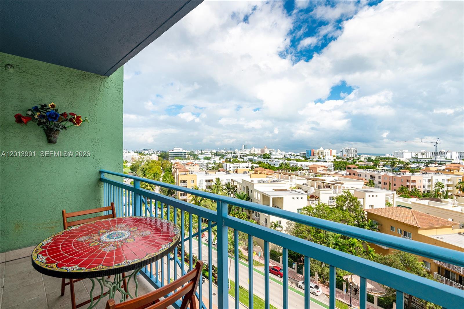 90 Alton Road, Unit 1007 Miami Beach, FL 33139 - Photo 23 of 25 a view of a balcony with an outdoor seating