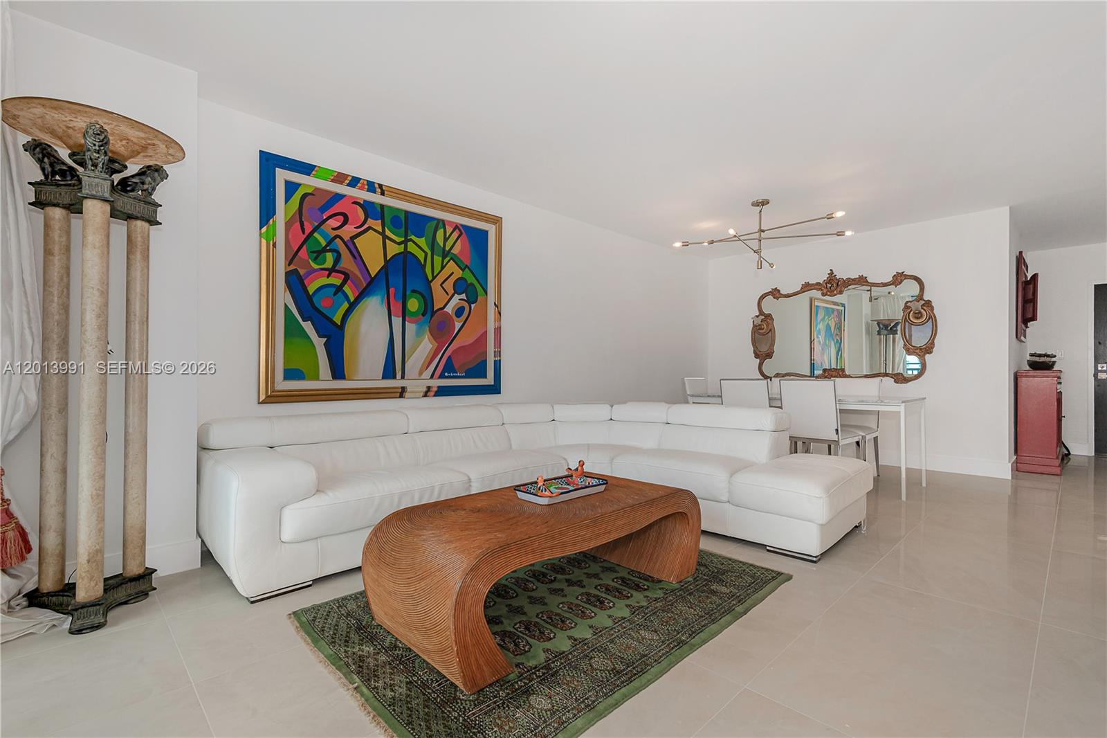 90 Alton Road, Unit 1007 Miami Beach, FL 33139 - Photo 3 of 25 a bedroom with a bed and a couch