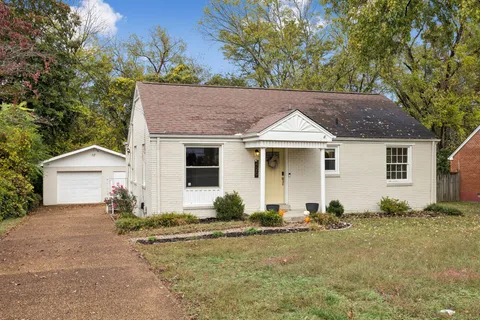 a front view of a house with yard