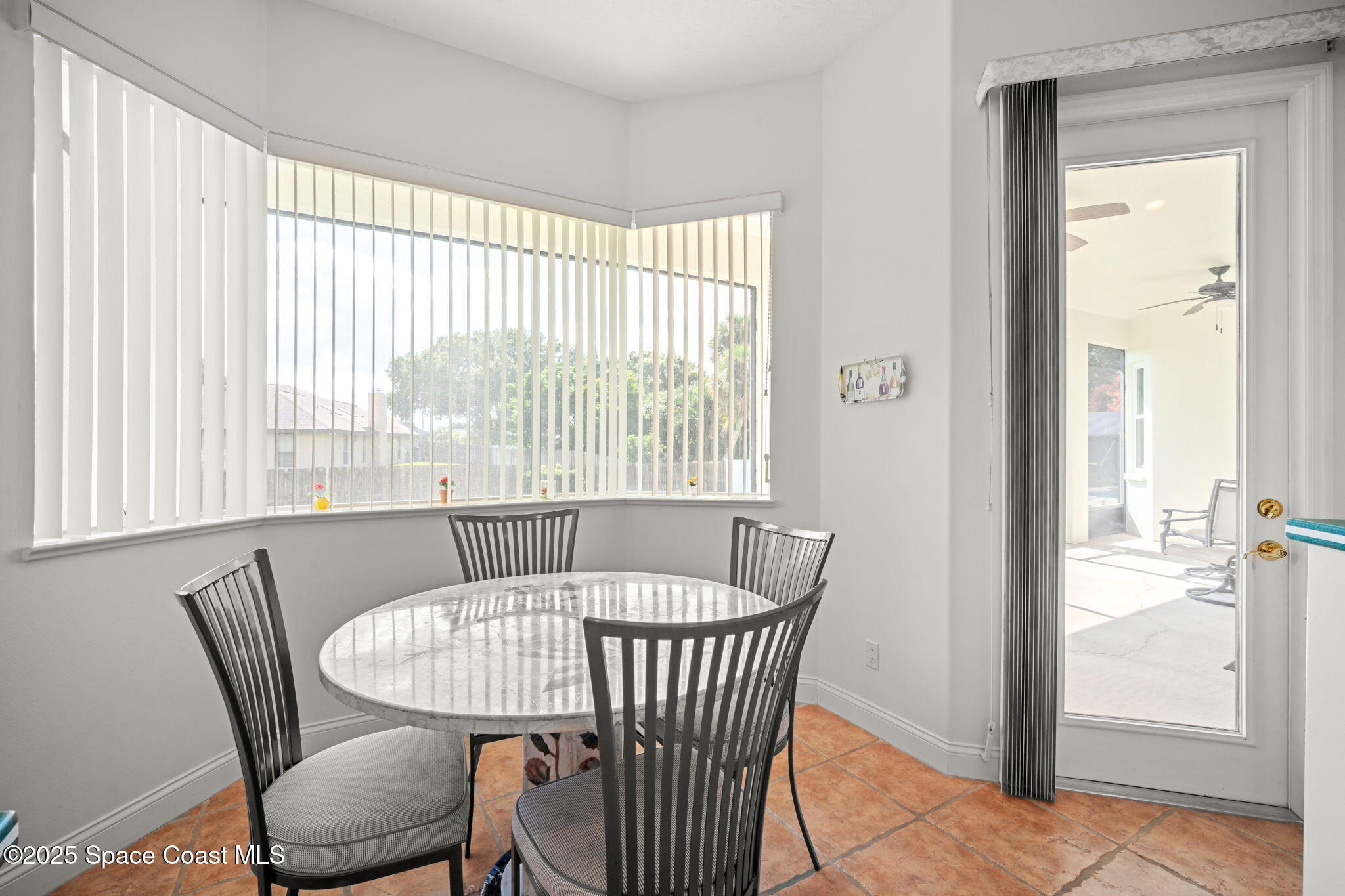 415 Indian Bay Boulevard Merritt Island, FL 32953 - Photo 15 of 37 a view of a dining room with furniture window and outside view