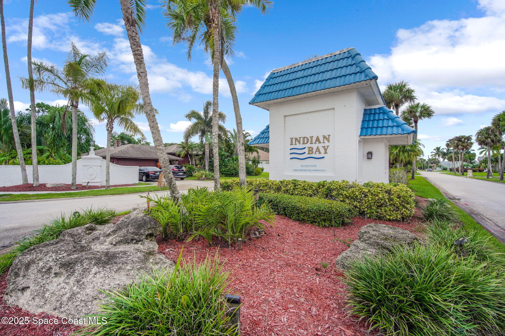 415 Indian Bay Boulevard Merritt Island, FL 32953 - Photo 2 of 37 a front view of a house with garden