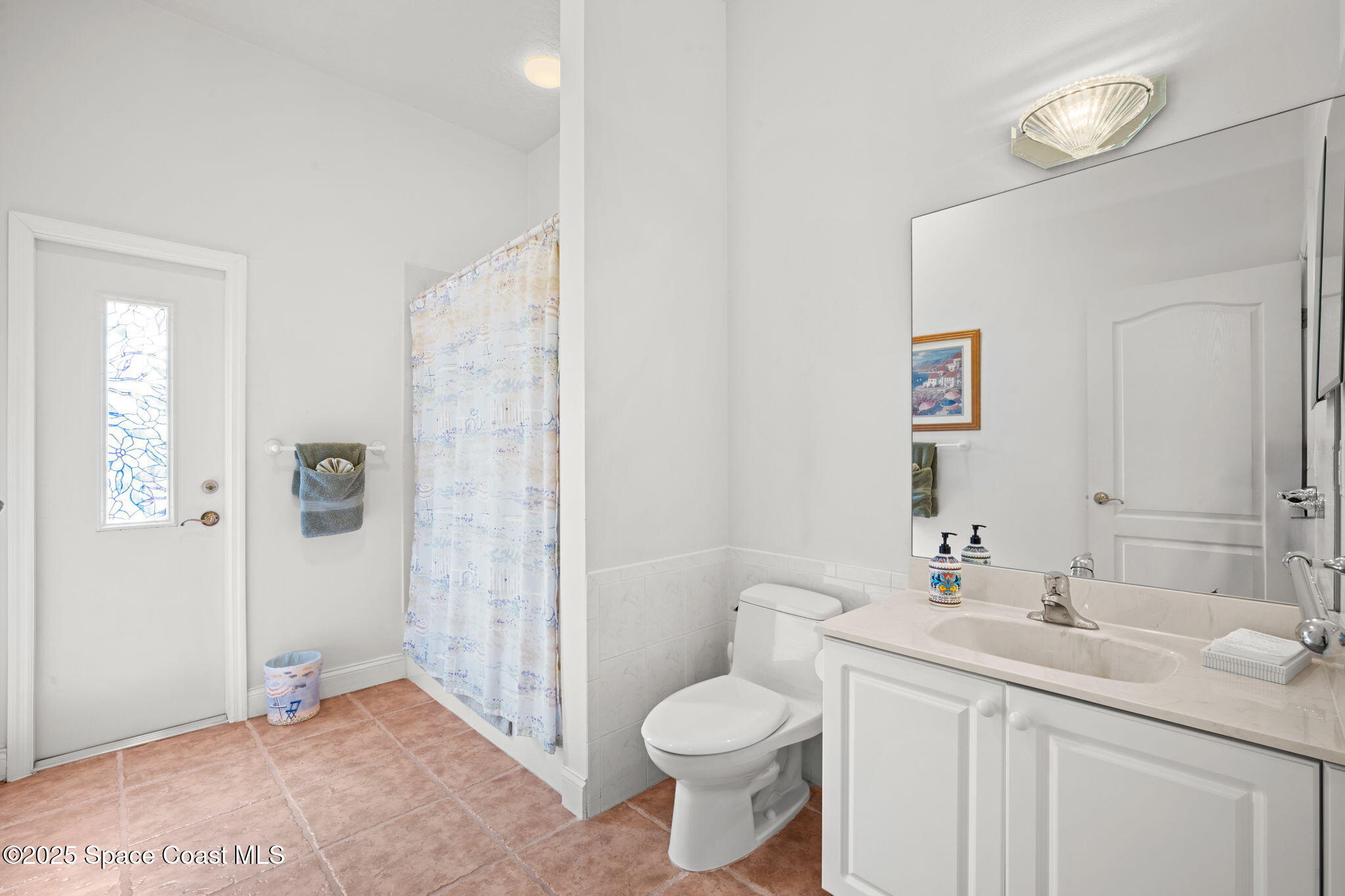 415 Indian Bay Boulevard Merritt Island, FL 32953 - Photo 24 of 37 a bathroom with a sink toilet and shower