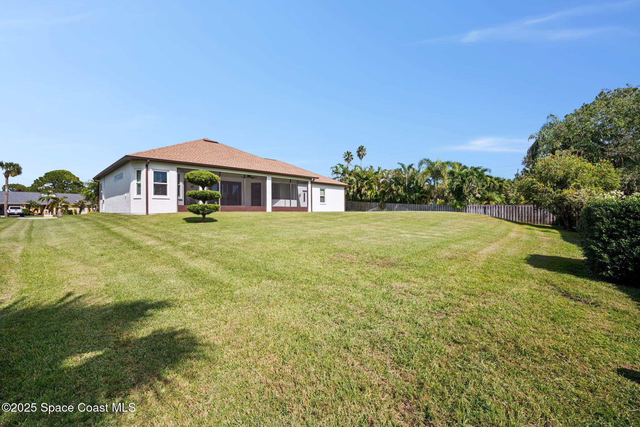 415 Indian Bay Boulevard Merritt Island, FL 32953 - Photo 26 of 37 a view of a house with a big yard