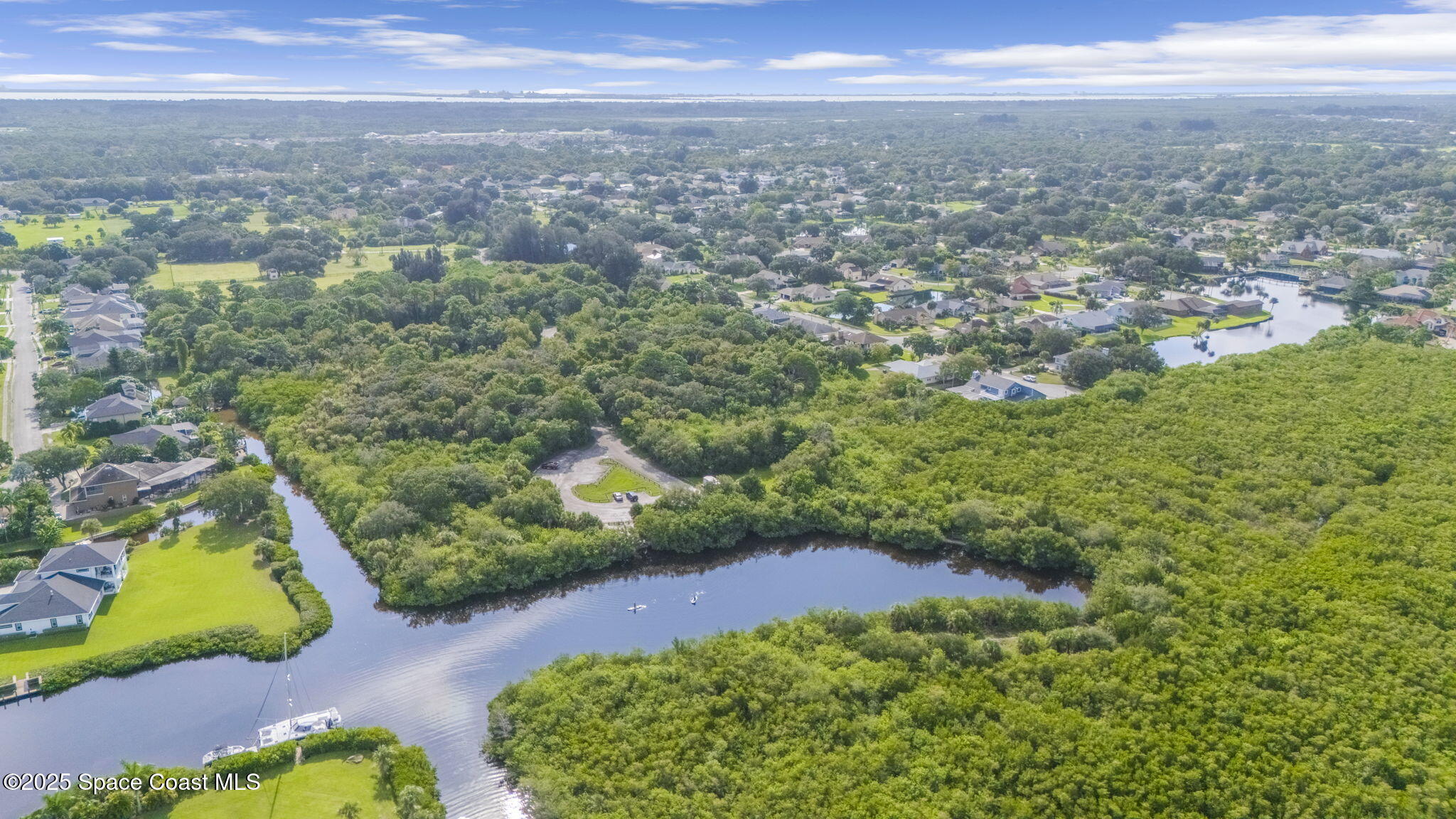 415 Indian Bay Boulevard Merritt Island, FL 32953 - Photo 29 of 37 a view of a yard with an ocean