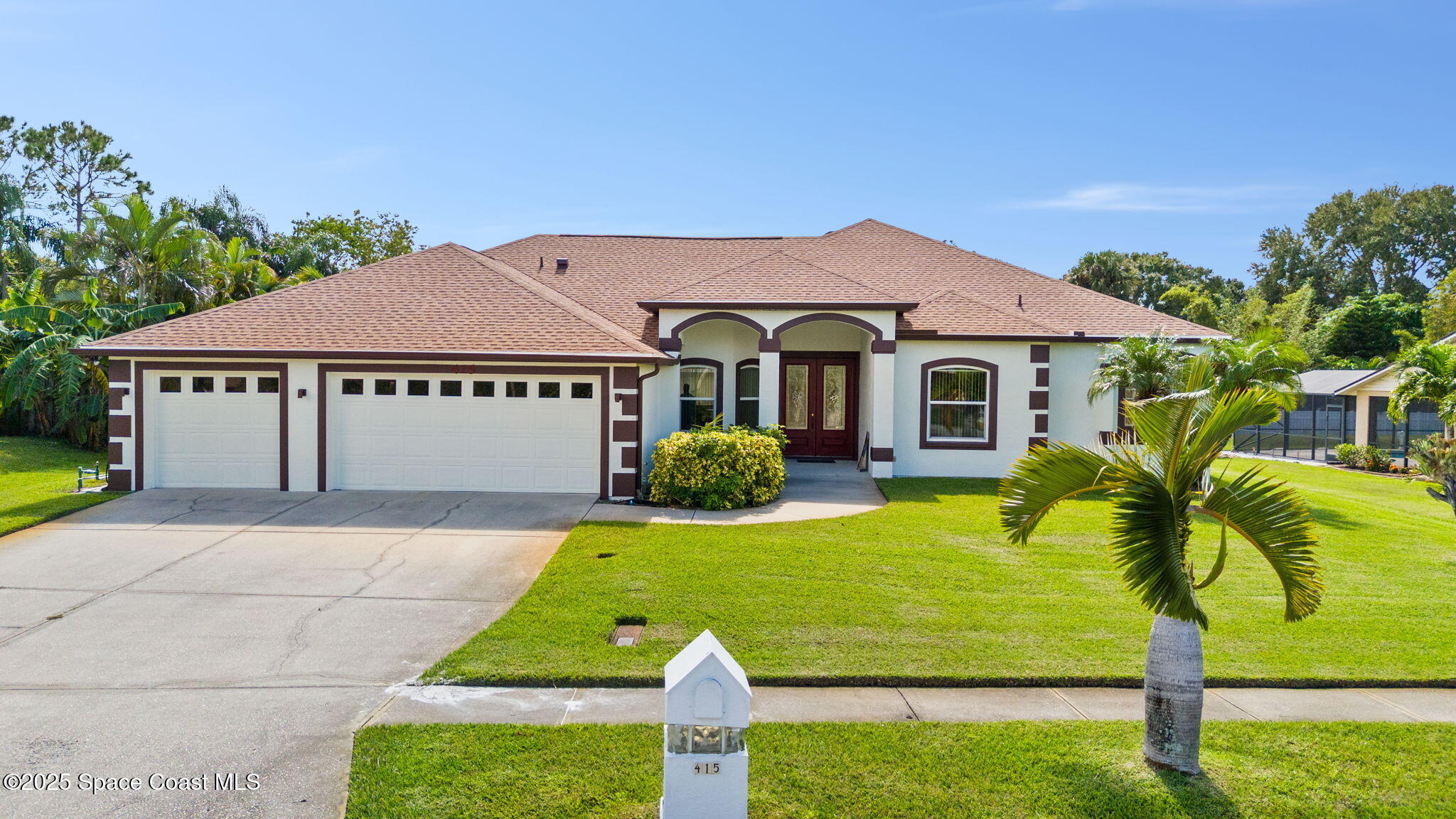415 Indian Bay Boulevard Merritt Island, FL 32953 - Photo 3 of 37 a view of house with garden