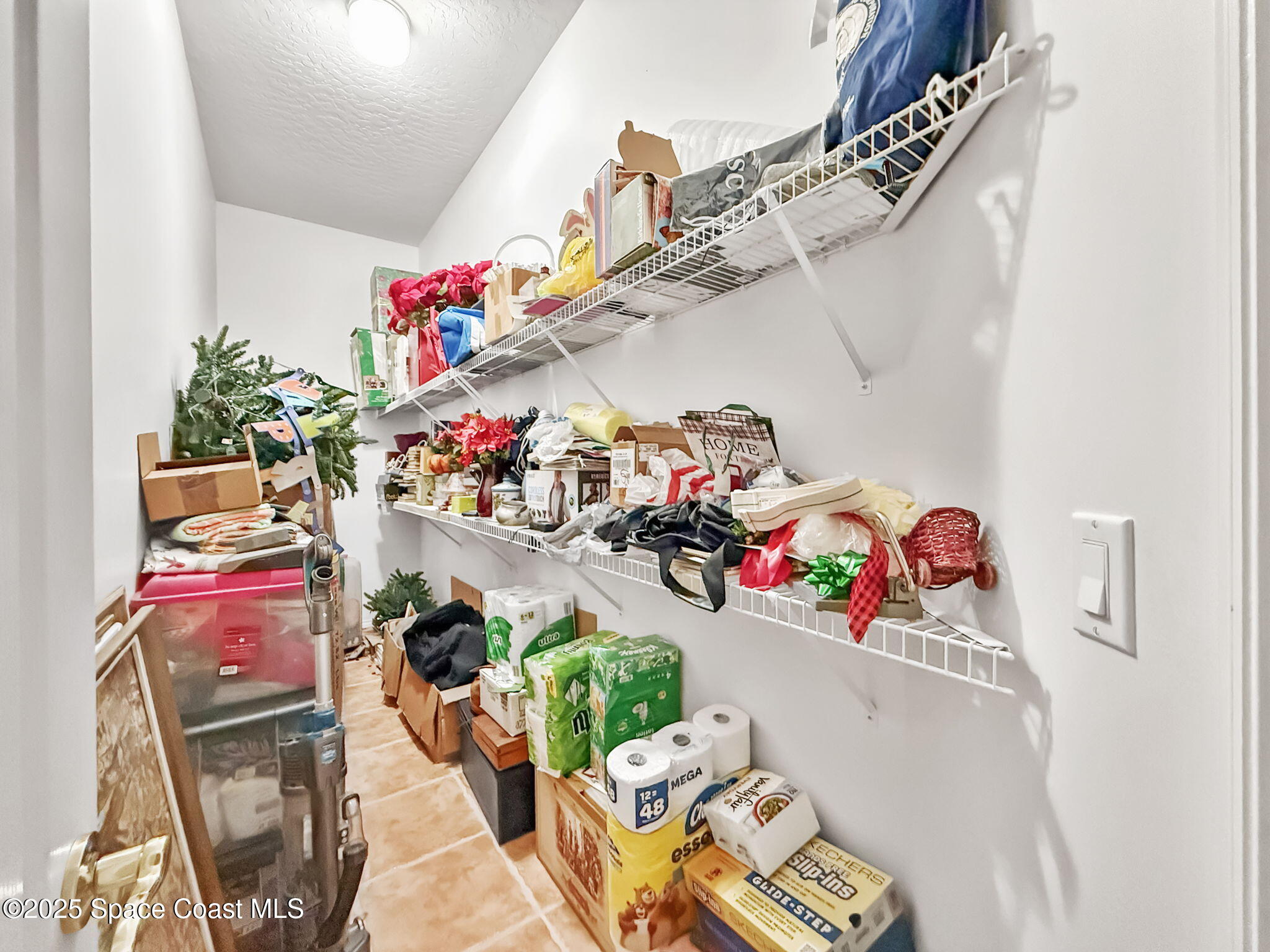 415 Indian Bay Boulevard Merritt Island, FL 32953 - Photo 35 of 37 a view of a storage room with a lot of stuff