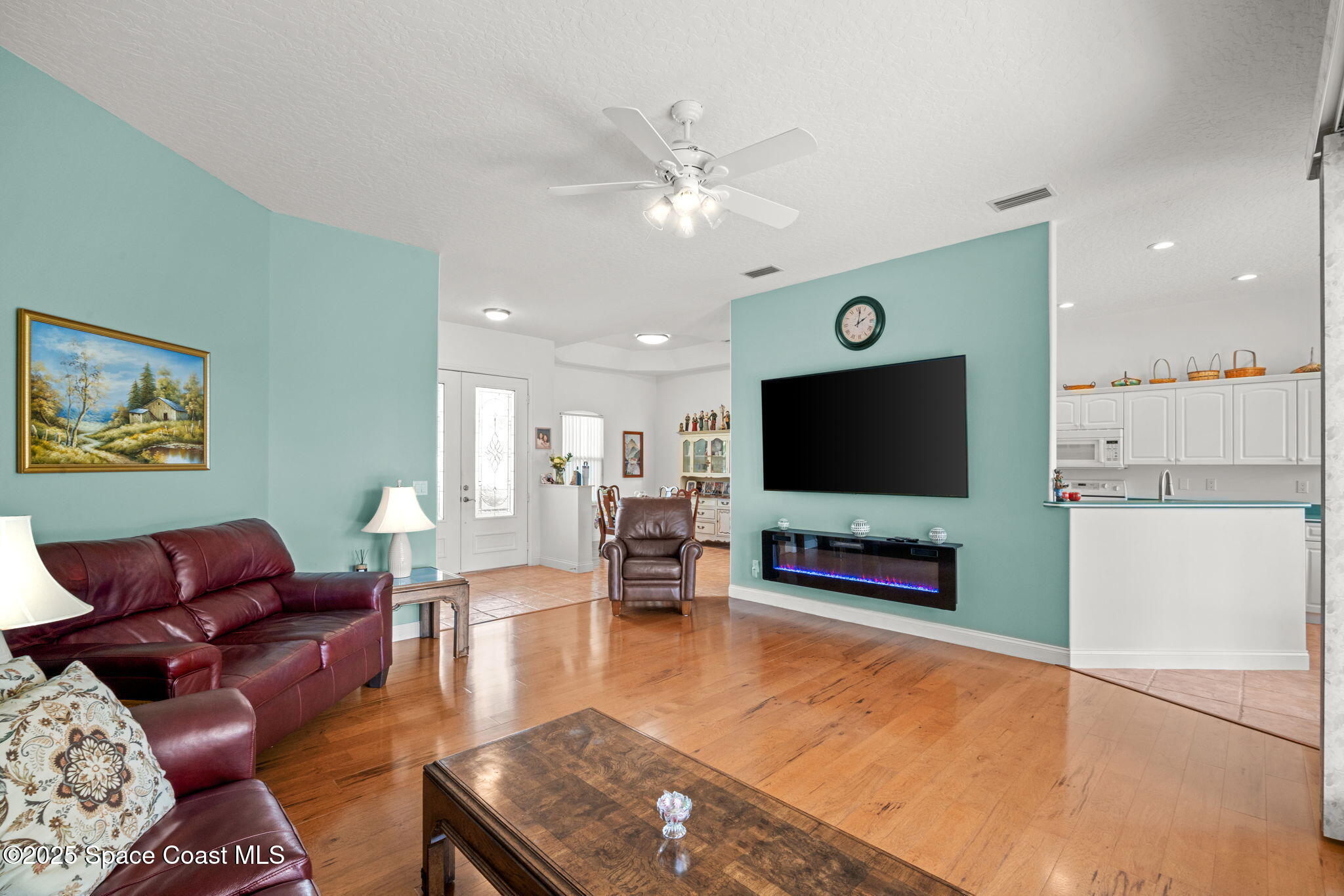 415 Indian Bay Boulevard Merritt Island, FL 32953 - Photo 9 of 37 a living room with furniture and a flat screen tv