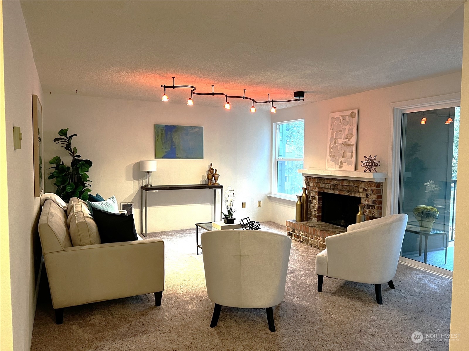 820 Cady Road, Unit C203 Everett, WA 98203 - Photo 19 of 19 a living room with furniture and a fireplace
