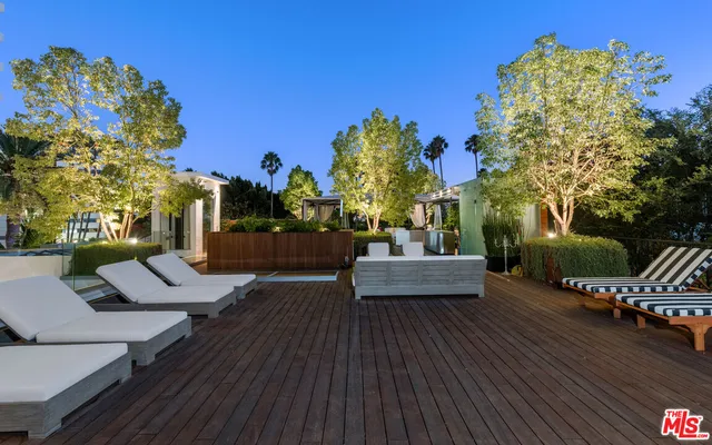a kitchen with a stove and a large window