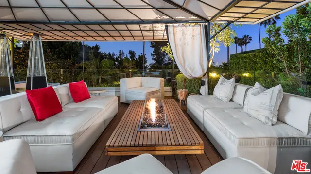 a living room with lots of furniture and gym equipment
