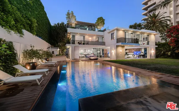 a view of a swimming pool with lounge chair