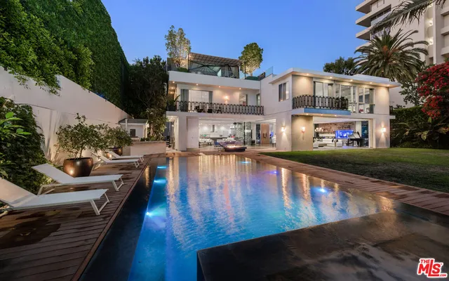 a view of a swimming pool with lounge chair