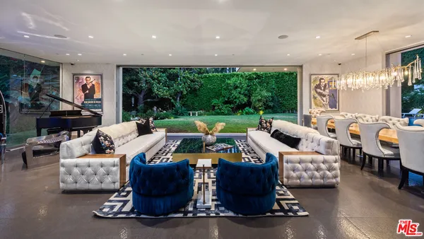 a bed room with furniture and a chandelier