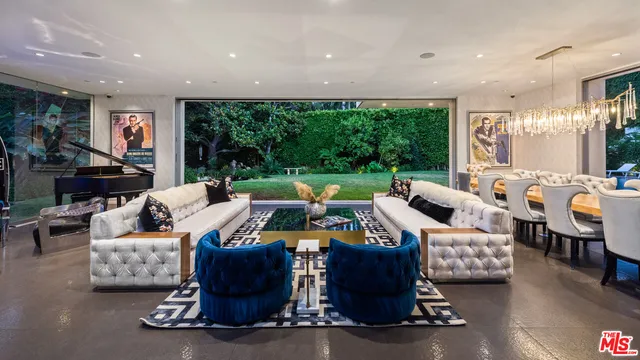 a bed room with furniture and a chandelier