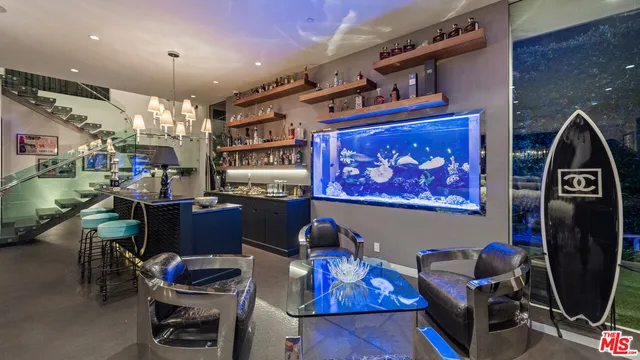 a room with gym equipment and large windows